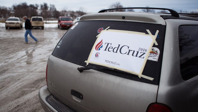 A Ted Cruz sign is affixed to a car window outside of an event for the Republican presidential candidate at Darrell's Place on Saturday, Jan. 30, 2016, in Hamlin, Iowa.