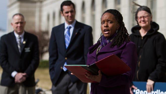 In this file photo, former Councilwoman Attica Scott, who is a current State House candidate, protests with others against Sen. Mitch McConnell's refusal to confirm the replacement of the recently deceased Associate Justice of the U.S. Supreme Court Antonin Scalia. Friday, February 19, 2016