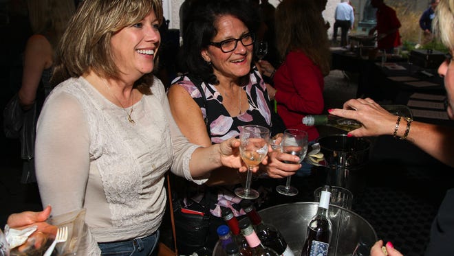 Guests enjoy the Roberson Wine & Food Fest at the Roberson Museum and Science Center Thursday, April 21.