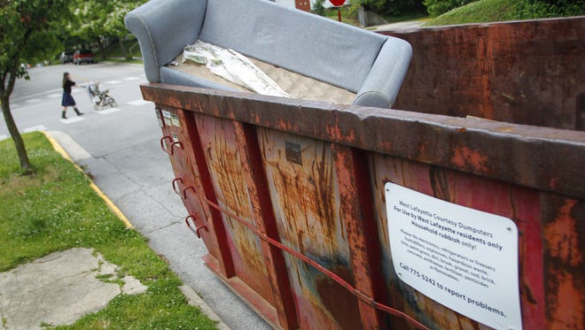 Discarded furniture and other items fill a courtesy dumpster at the intersection of Lutz Avenue and Salisbury Street in this 2012 file photo.
