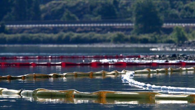 Booms have been set up in the Columbia River as seen the morning of Saturday, June 4, 2016.  The booms are meant to contain any oil that may seep into the river from a Union Pacific oil train that derailed near Mosier, Ore., on Friday.