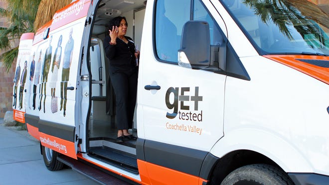 Community members tour the Get Tested Coachella Valley mobile testing unit in Palm Desert.