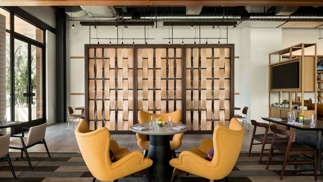 Weft & Warp Art Bar + Kitchen's room divider represents the weft & warp weave.