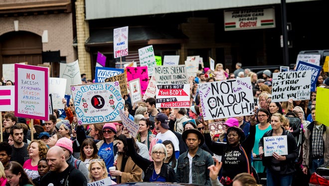 Thousands participate in the Cincinnati Sister March, a complement to the Women's March on Washington Saturday, January 21, 2017. 