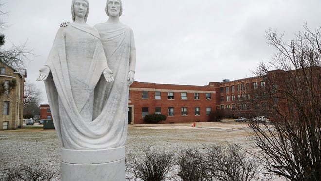 A statue of Saint Joseph the Educator and Jesus on the campus of Saint Joseph's College Friday, January 27, 2017, in Rensselaer. Financial challenges at the Catholic college, which has an enrollment of about 1,200 students, may force the school to close.