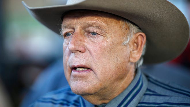 In this April 11, 2015, file photo, Nevada rancher Cliven Bundy speaks with supporters at an event in Bunkerville, Nev. The Bundy trial stems from a land-use case, which erupted in 2014 when armed ranchers and militia members mounted a six-day standoff against Bureau of Land Management officials.