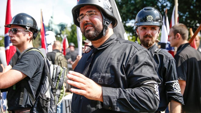 Matt Heimbach, a white nationalist who calls Indiana home, makes his way into Emancipation Park during the "Unite the Right" rally in Charlottesville on Saturday, Aug. 12, 2017.