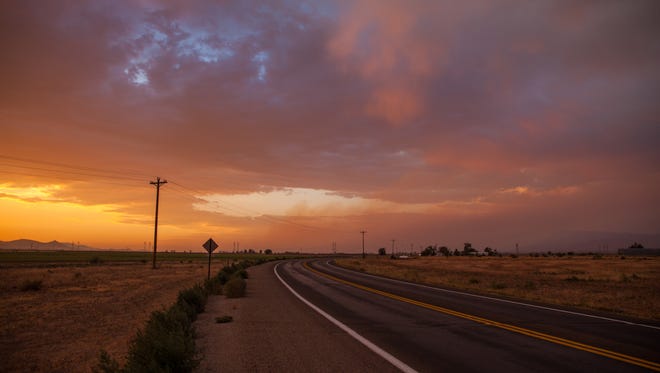 The sun sets over a road near Winchester Heights, a colonia community outside the city limits of Wilcox, Ariz. (Maria Esquinca/News21)