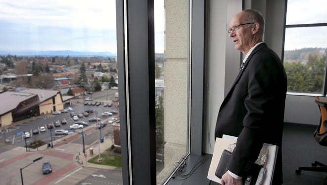 City of Bremerton Public Works and Utilities director Chal Martin looks at the view from the corner conference room on the fifth floor of the Norm Dicks Government Center. Martin was fired Tuesday after an internal city investigation.