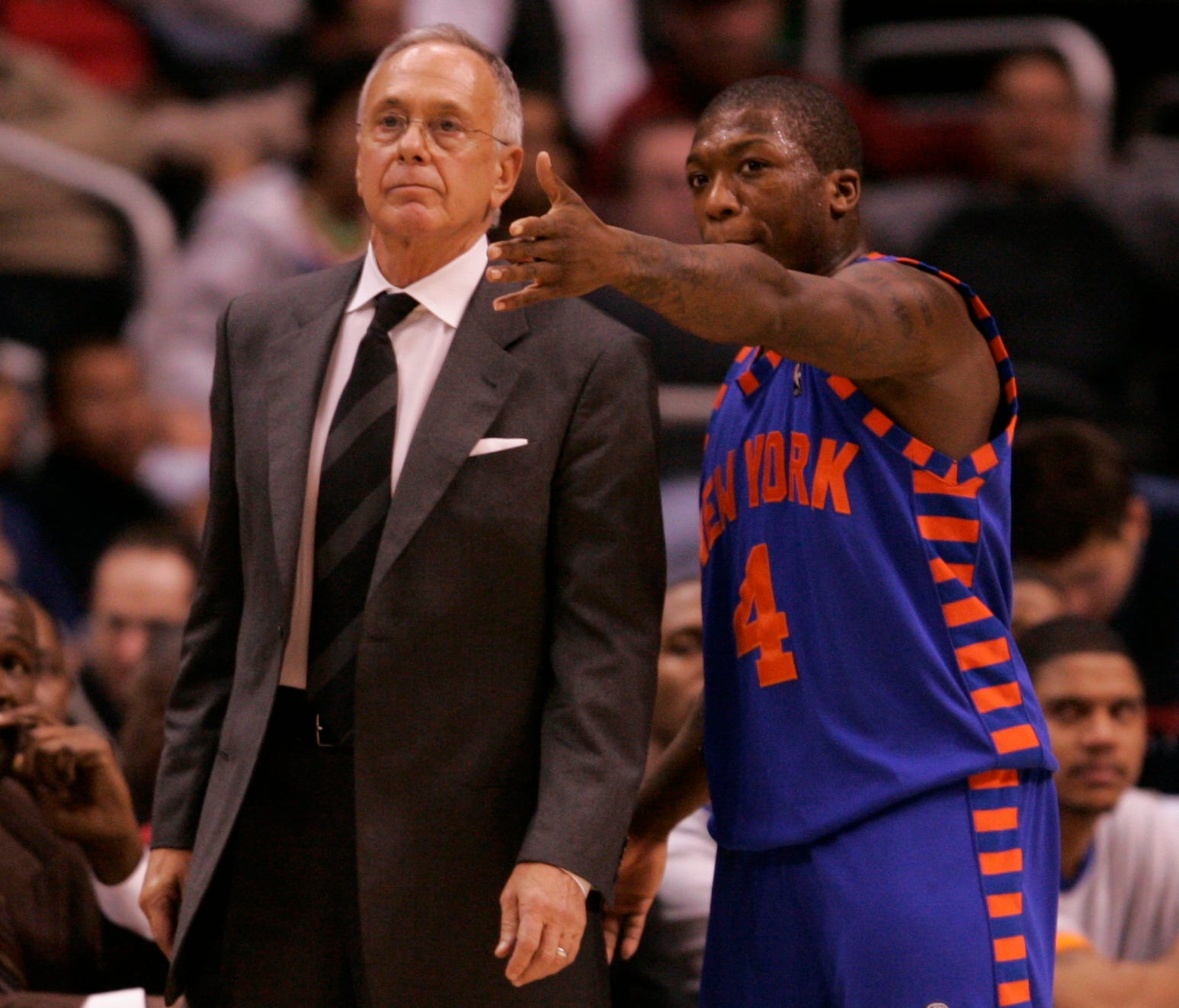Former New York Knicks guard Nate Robinson talks to then head coach Larry Brown in 2005.