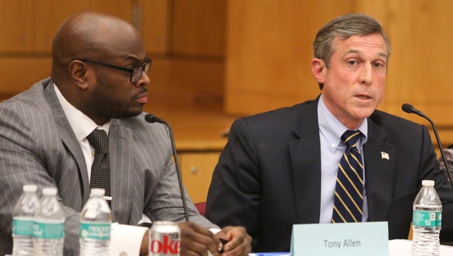 Wilmington Education Improvement Commission Chairman Tony Allen listens to Gov. John Carney during a meeting of the group Tuesday at the Sharp Conference Center.