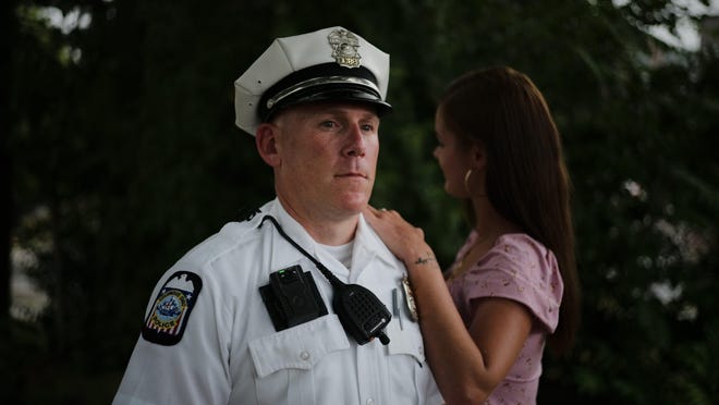 Columbus Division of Police Officer Eric Clouse and sex trafficking survivor Jennifer Bates at Dodge Park on Sullivant Avenue. Bates, 27, who asked that her face not be photographed, has been on and off the streets of Columbus since she was 12 and credits Clouse for saving her life.