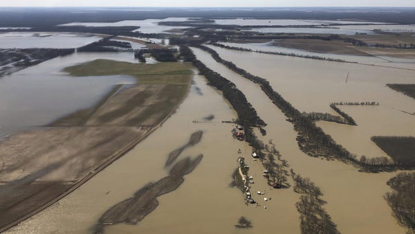 Backwater flooding covers stretches of farm land n