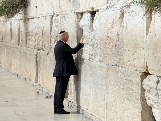 President Trump touches the Western Wall, Judaism's