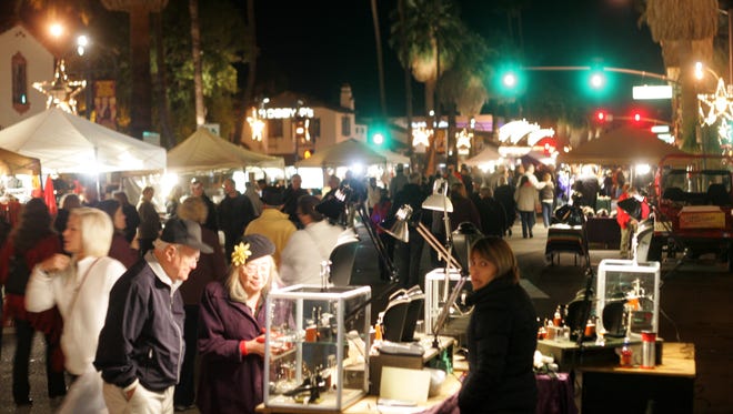 Residents and tourists alike flock to Palm Springs for VillageFest along Palm Canyon Drive.