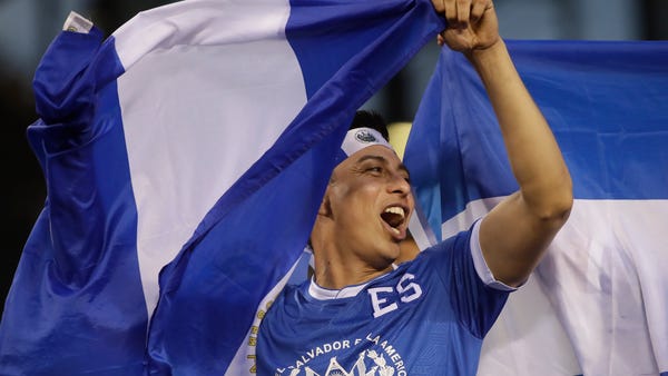 An El Salvador fan cheers before a CONCACAF Gold C