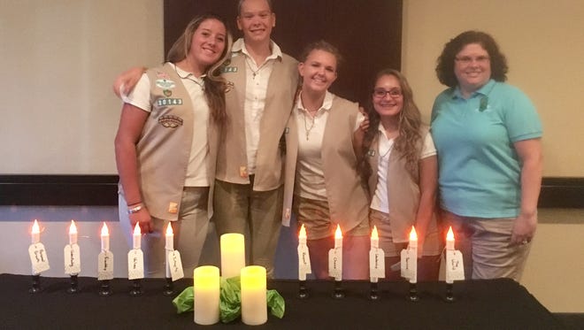 Troop 30143's Emily Cooper, Emily Miller, Roxy Goodman, Kathryn Thorsen, and Troop Leader Laura Thorsen renewed their commitment to the Girl Scout Promise and Law.