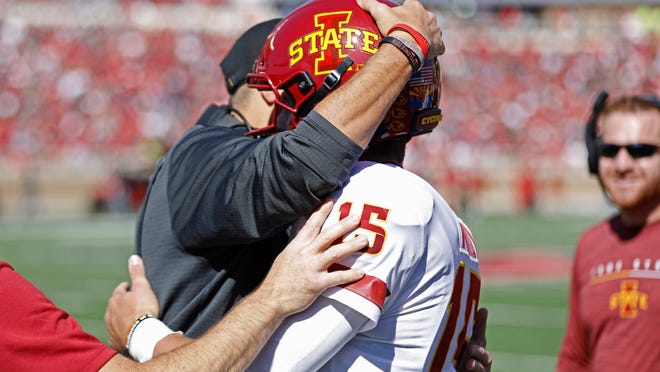 Iowa State coach Matt Campbell hugs Brock Purdy (15) after scoring a touchdown during the first half of an NCAA college football game against Texas Tech, Saturday, Oct. 19, 2019, in Lubbock, Texas. (Brad Tollefson/Lubbock Avalanche-Journal via AP)