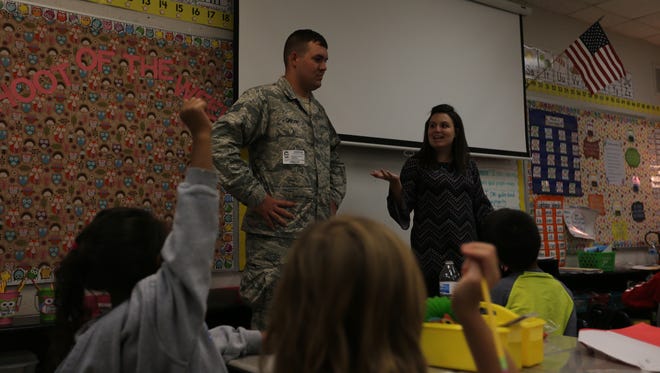 Staff Sgt. Douglas Carson II speaks in front of his sister Amie Abel's first grade class at David Youree Elementary School on Monday. Carson surprised Abel in her class after returning from a deployment in Korea.