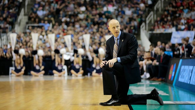 Xavier Musketeers head coach Chris Mack looks back to his assistant coaches as the Musketeers fall behind in the second half.