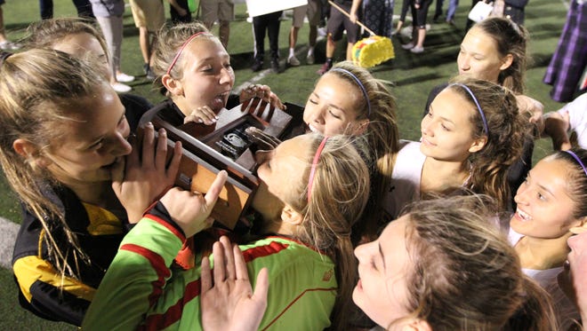 Bishop Verot celebrates winning the District 2A-12 girls soccer title 1-0 over Oasis.