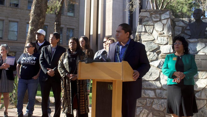 Rep. Eric Descheenie, D-Chinle, stands in front of a crowd of state lawmakers and Native American activists, introducing his bill, HB 2499. The bill would prohibit publicly-funded stadiums or multipurpose facilities from displaying a logo or term deemed offensive by a federally recognized Arizona Native American Tribal Council.