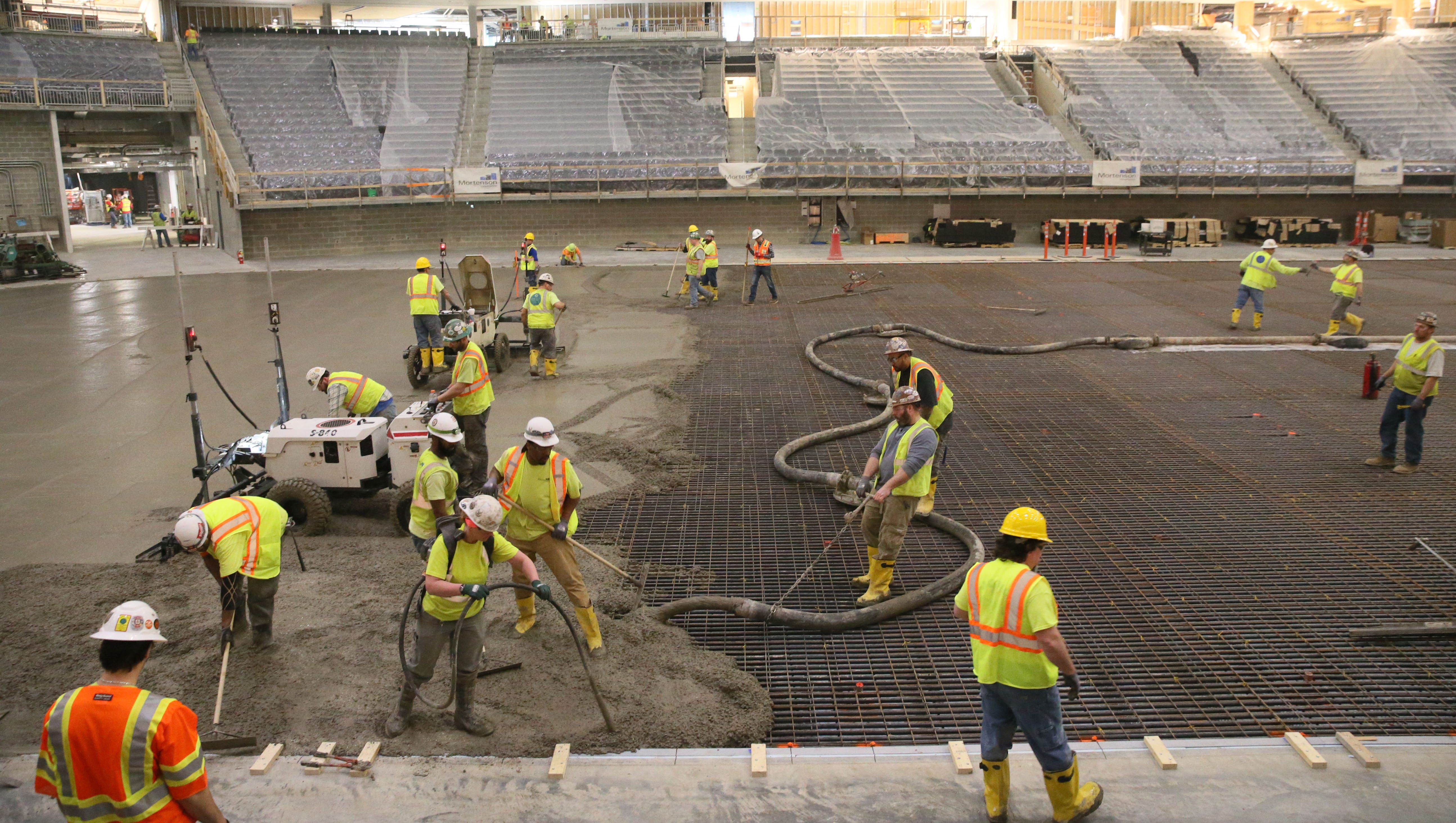 Bucks Arena Workers Install The Concrete Pad For The Ice Sheet