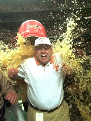 Coach Phillip Fulmer gets doused with Gatorade after the Volunteers' 24-14 win over Mississippi State in the SEC Championship game Dec. 5, 1998, at the Georgia Dome.