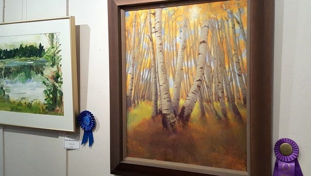 Susan Sinyai's "Aspen Light" pastel painting took Best of Show.