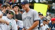 New York Yankees right fielder Aaron Judge (99) signs