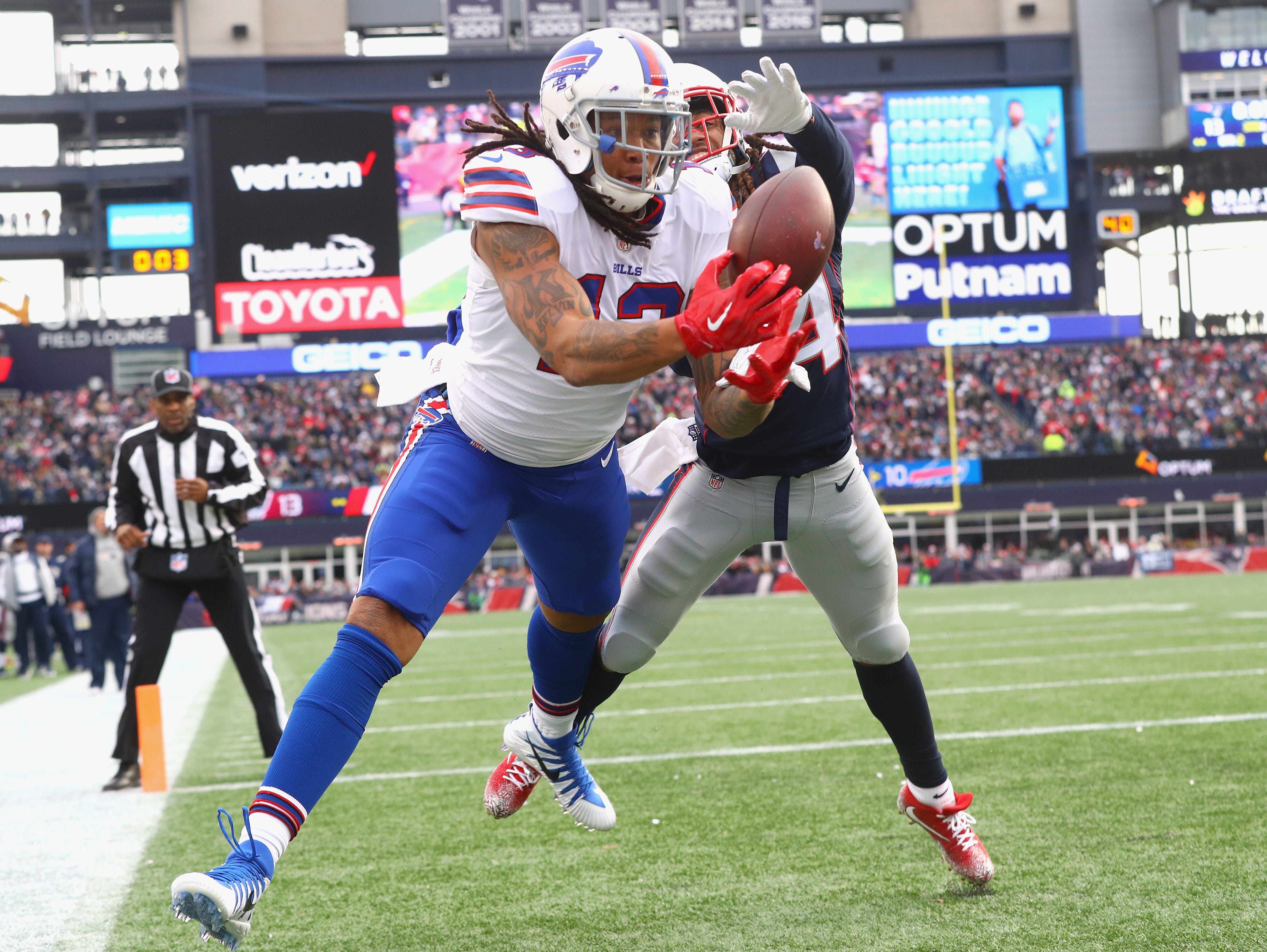 Kelvin Benjamin of the Buffalo Bills tries to catch a pass as he is defended by Stephon Gilmore #24 of the New England Patriots during the quarter of a game against the Buffalo Bills at Gillette Stadium on December 24, 2017 in Foxboro, Massachusetts.