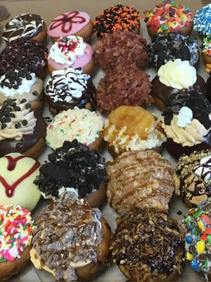 A variety of flavored doughnuts from Peace, Love and Little Donuts.