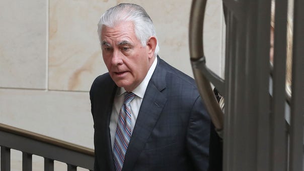 Secretary of State Rex Tillerson leaves a closed briefing