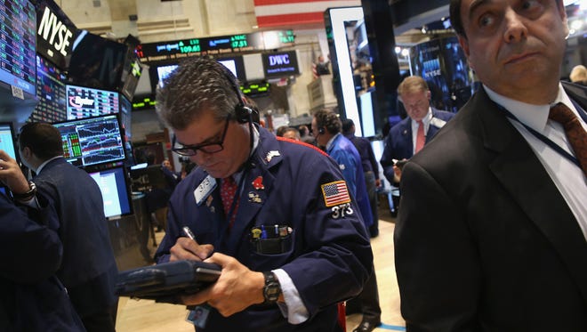 Traders work the floor of the New York Stock Exchange on, Wednesday.