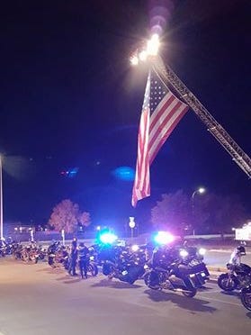 Motorcycles line a street as the body of retired Las Cruces police Officer returned to Las Cruces on Wednesday morning.