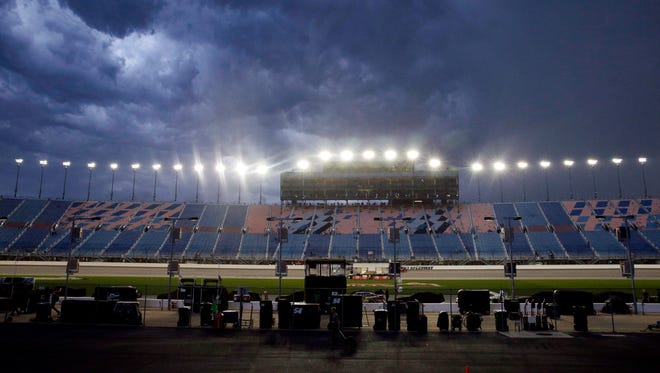 Dark clouds move across the sky before the NASCAR Xfinity series race at Chicagoland Speedway on Saturday night.