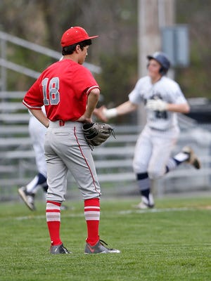 West Lafayette reliever Charlie Ho looks on as Ben Metzinger rounds the bases after hitting a three-run homer to right with one out in the bottom of the fifth inning Wednesday, April 20, 2016, at Central Catholic. Metzingers homer put CC up 5-1. CC would go on to beat West Lafayette 8-1.