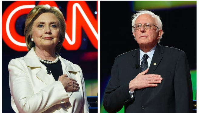 This two-picture combination shows US Democratic presidential candidates Hillary Clinton (L) and Bernie Sanders before the CNN Democratic Presidential Debate at the Brooklyn Navy Yard on April 14, 2016 in New York.