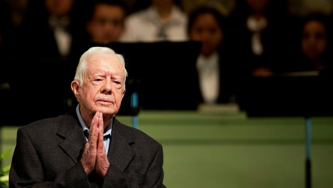 FILE - In a Sunday, Aug. 23, 2015 file photo, former President Jimmy Carter teaches Sunday School class at Maranatha Baptist Church in his hometown, in Plains, Ga. Former President Carter said Sunday, Dec. 6, 2015, that no cancer was detected in his latest scan. (AP Photo/David Goldman, File)