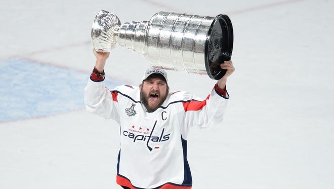 Washington Capitals left wing Alex Ovechkin (8) hoists the Stanley Cup after defeating the Vegas Golden Knights in game five of the 2018 Stanley Cup Final at T-Mobile Arena.