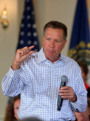 John Kasich, Ohio Governor and Republican presidential candidate, speaks to a crowd at a town hall style meeting at the Portsmouth Country Club while campaigning in New Hampshire on Wednesday, July 22.