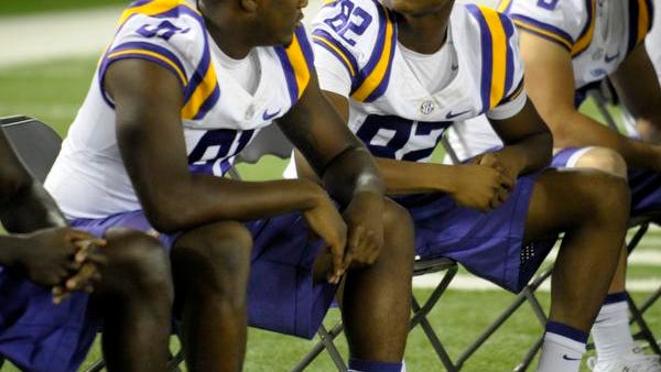 LSU wide receiver D.J. Chark (82) speaks to receiver Tony Upchurch (81) at the LSU Charles McClendon Football Practice Facility in Baton Rouge in 2014.