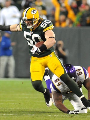 Green Bay Packers linebacker A.J. Hawk runs back an interception against the Minnesota Vikings during the 3rd quarter of the game at Lambeau Field in Green Bay, Wis., on Sunday, Oct. 24, 2010.