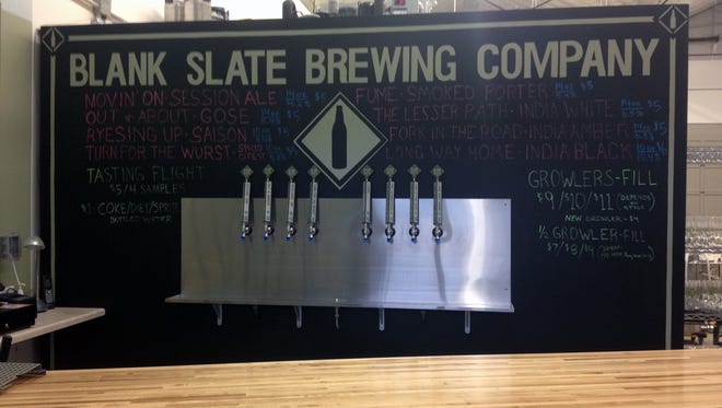 A board at Blank Slate Brewing Company's Pour House tap room.