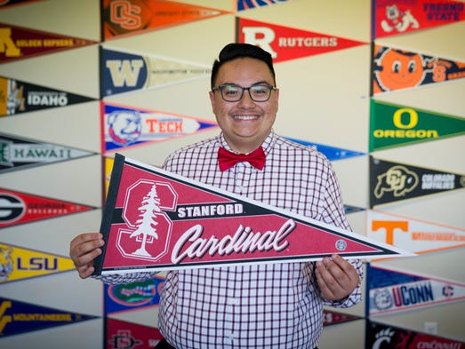Luis Jimenez, 17, poses for a portrait with a Stanford