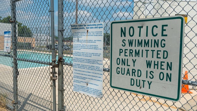 A notice on the Plum St pool that will be closed until at least July 4th.
