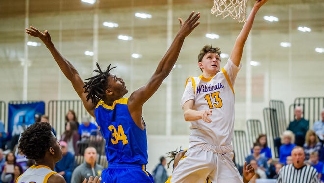 Blue Springs guard Braden Appelhans (13) coasts in for a layup in a game against Ruskin last season. Appelhans has garnered interest from several NCAA Division I college programs this summer as he heads into his junior season.