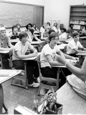 1983 photograph of Fran Schiedt teaching 9th grade English at West High School.