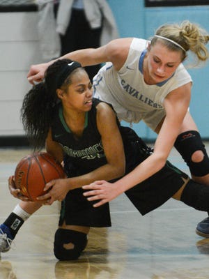 St. Thomas More's Taylor Kirby (right) ranks second on the team in scoring and leads it in rebounding.