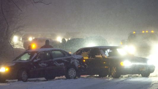 A car accident blocks traffic along Suitland Parkway during a snowstorm in Washington, D.C., on Jan. 26, 2011.